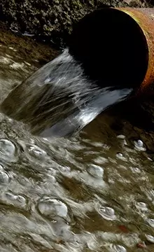 water running from drain pipe